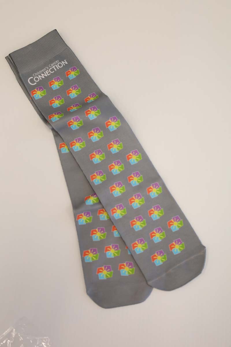 photo of grey socks with full color ccc logo scattered